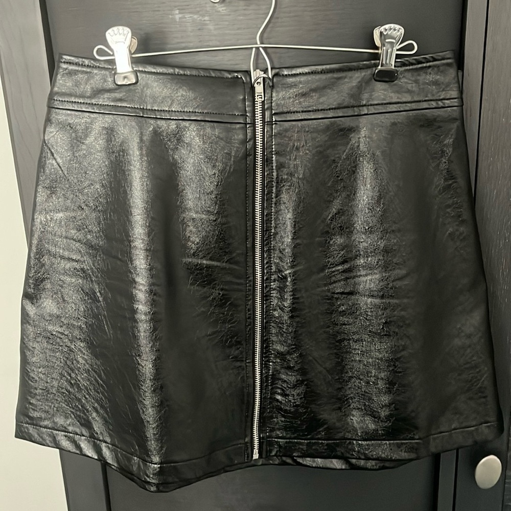 Aqua medium, zip up faux leather skirt. end to end waist is 15 in, hips 20 in